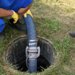 A well-maintained septic system being inspected outdoors to support proper septic tank maintenance and long-term performance.